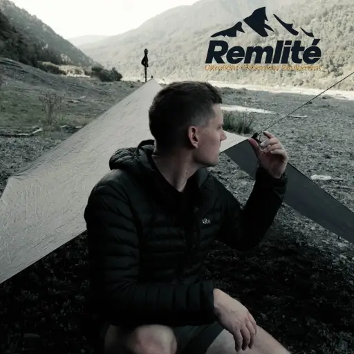 Stan Leenders, owner of Remlite, in a tent using ultralight camping gear on a hiking trail