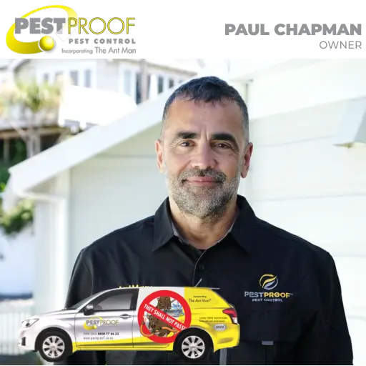 Paul Chapman from Pestproof Pest Control in uniform standing beside a branded vehicle